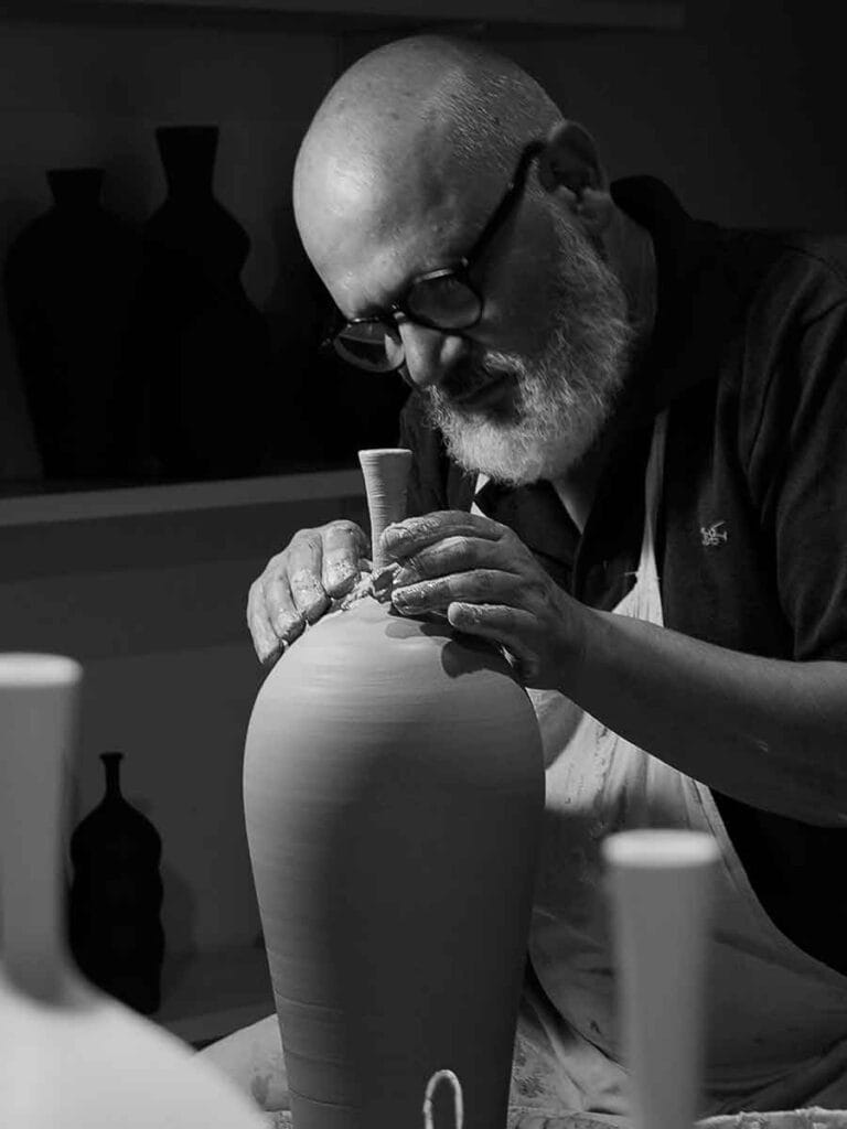 Freshly thrown stoneware piece on the wheel — raw clay ceramic by Fernando Durao, Buenos Aires studio