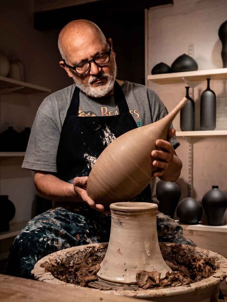 Fernando Durao at work in his Buenos Aires pottery studio — wheel-thrown stoneware, 35 years of practice