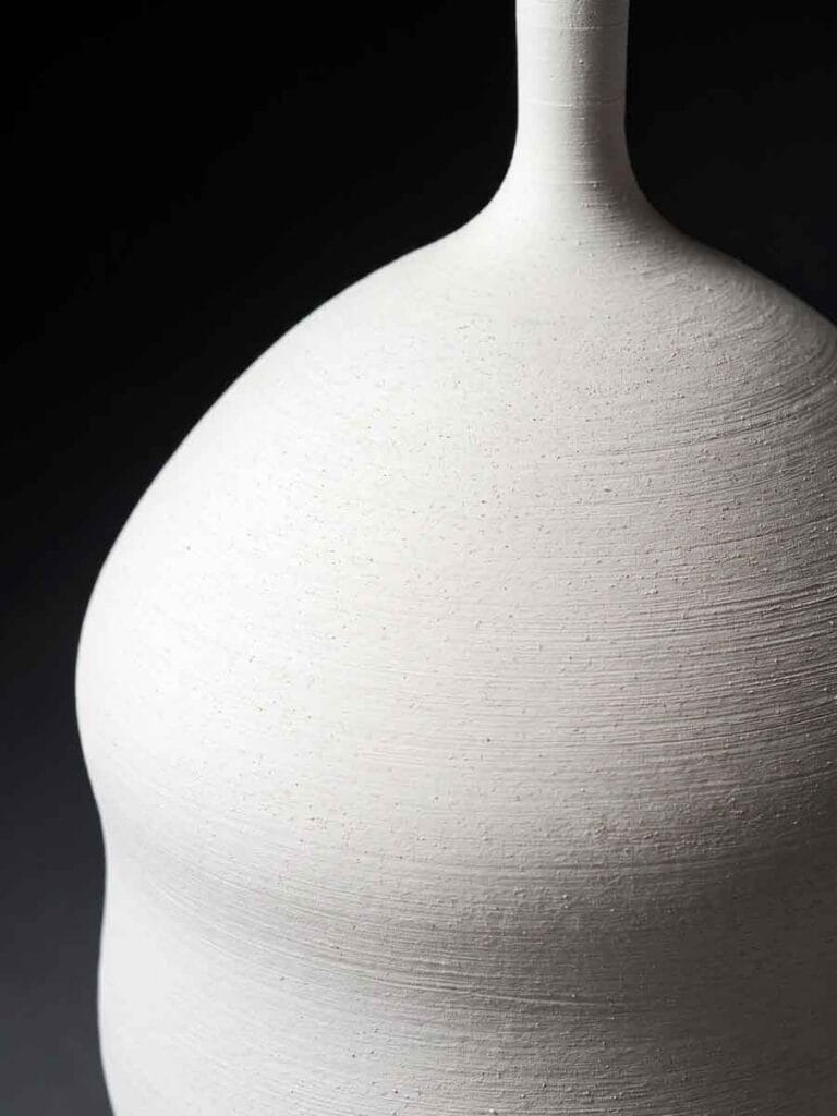 White stoneware vase surface detail — kaolin feldspar quartz mineral slip, Unikas Quartz by Fernando Durao