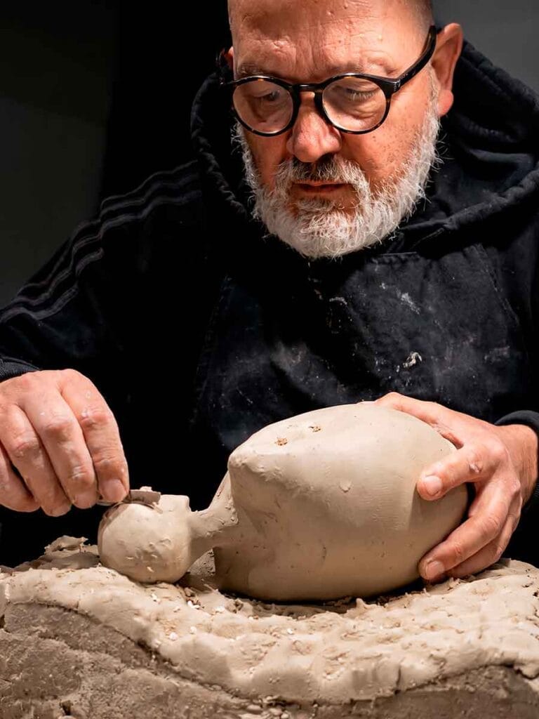 Fernando Durao building abstract ceramic sculpture by hand — pinching and paddling stoneware, Buenos Aires studio