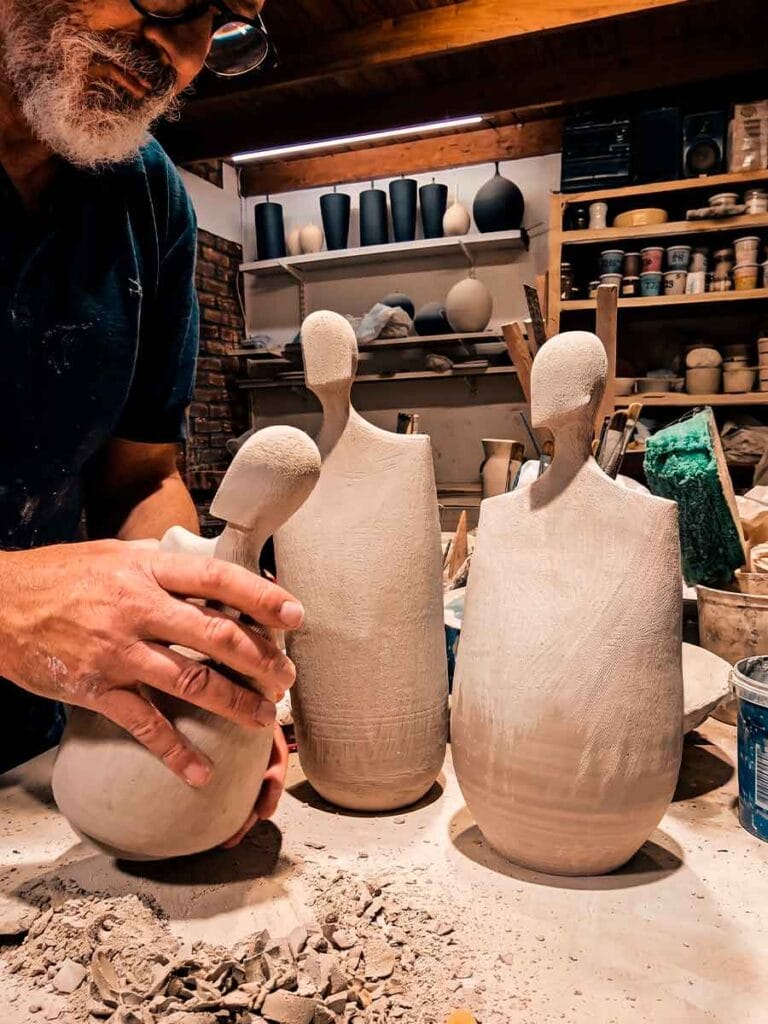 Fernando Durao building abstract ceramic sculpture by hand — pinching and paddling stoneware, Buenos Aires studio