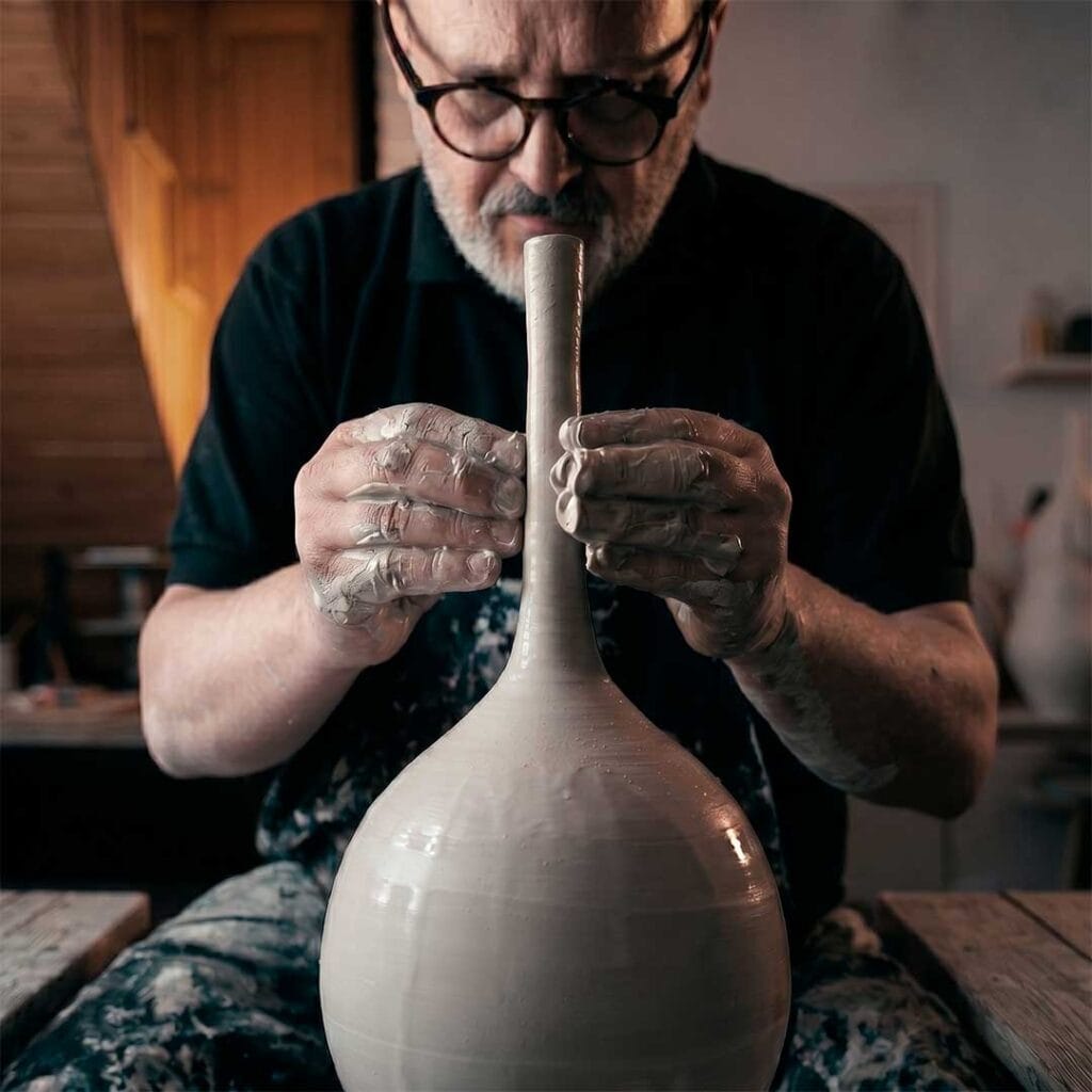 Fernando Durao throwing wheel-thrown stoneware in his Buenos Aires studio — 35 years of studio pottery